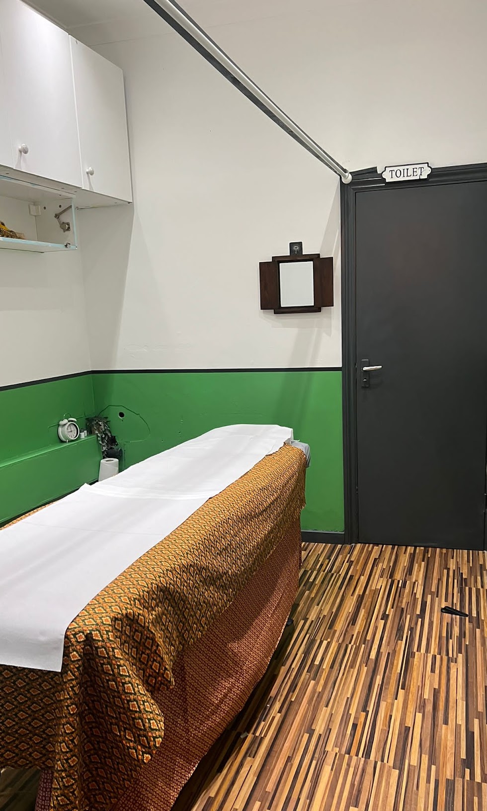 Calm, private treatment room with massage bed